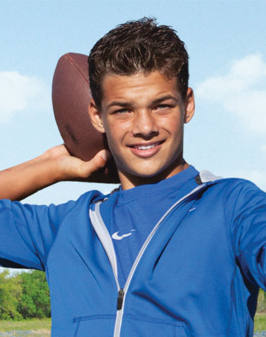 teen with football